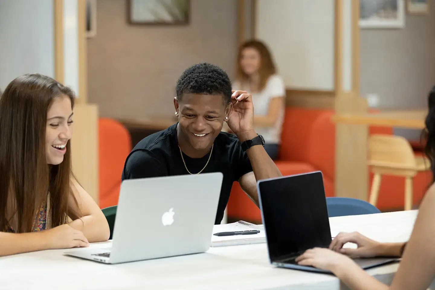 students laughing and studying at The Verge